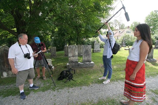Footsteps of Our Ancestors – Mohican Walking Tour of Stockbridge Video crew recording Bonney Hartley at Stockbridge Town Cemetery