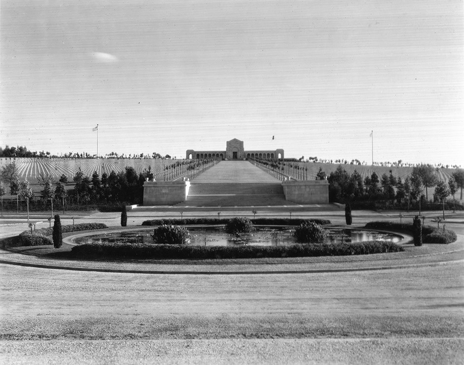 Black and white photo of pond and lawn in front of chapel