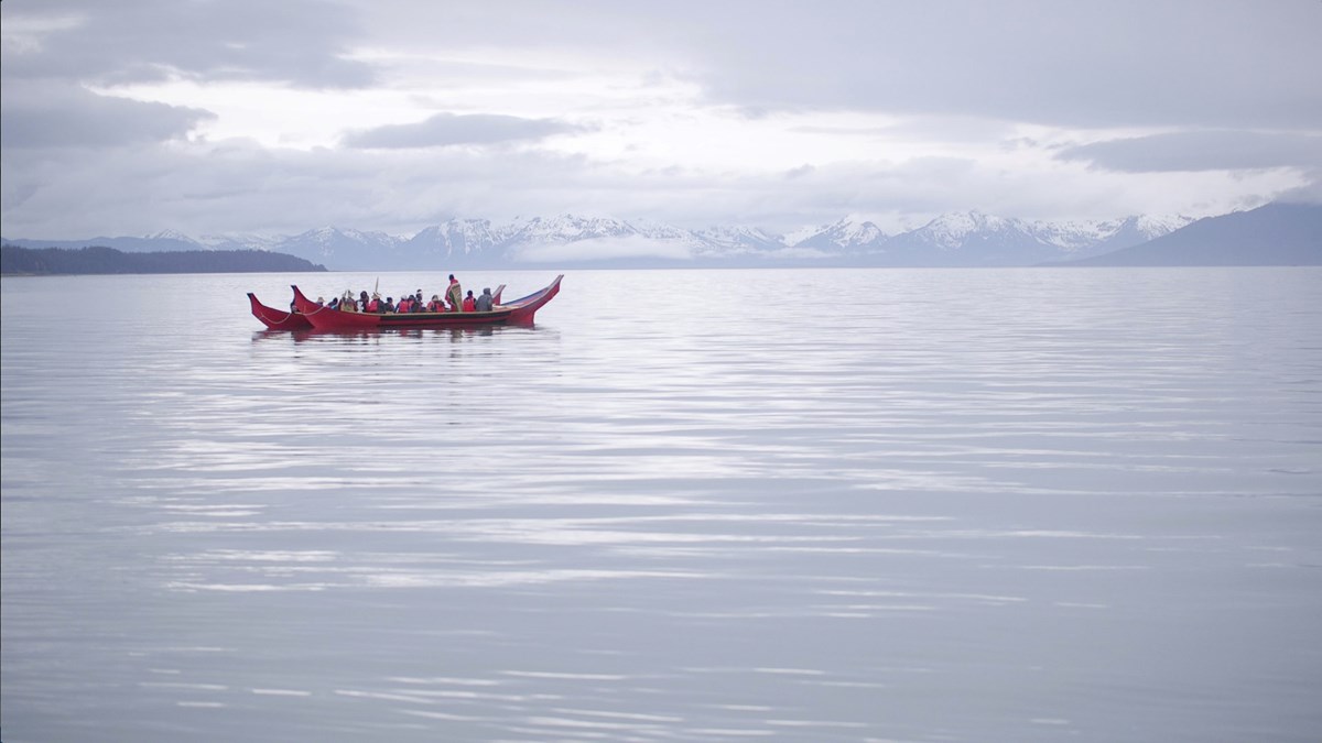 Tlingit canoes on glassy water