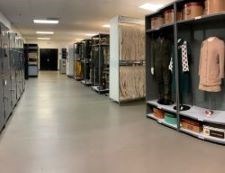 NPS History Collection storage Room with museum cabinets and mannequins displaying uniforms