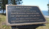 A bronze plaque identifying a site as listed in the National Register of Historic Places.