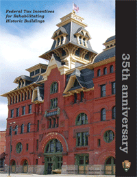 The cover of a report published for the 35th anniversary of the Federal Historic Rehabilitation Tax Credit program featuring a large brick Victorian building.