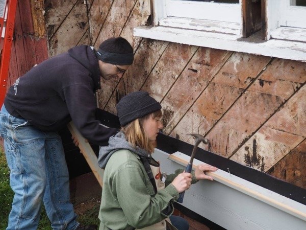 Students hammering a frame