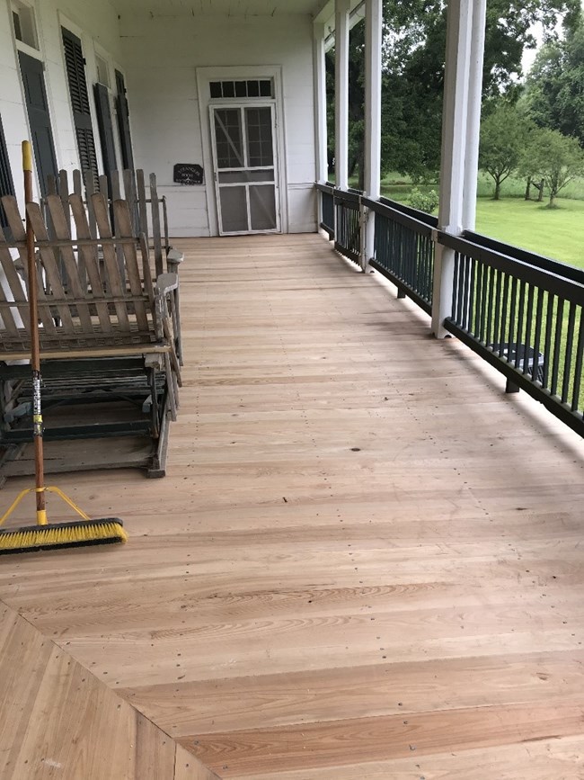 Cane River Creole-Oakland Plantation decking complete Wrap-around porch with new wooden floorboards