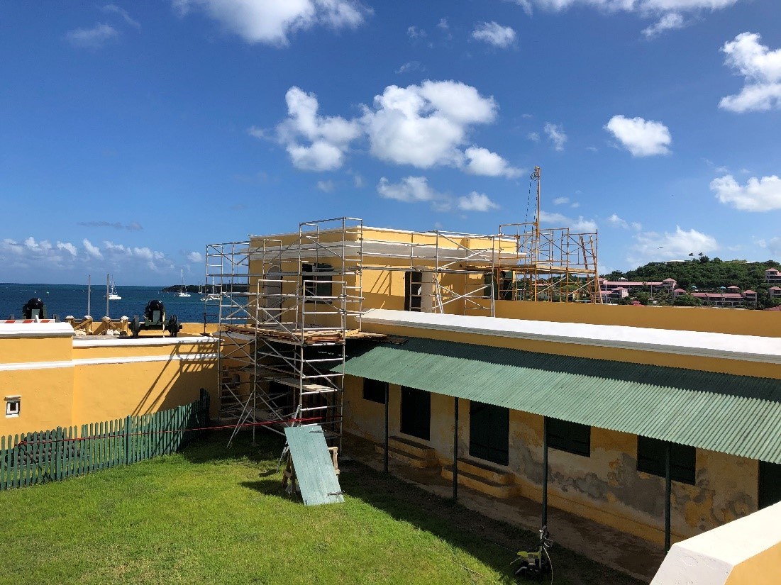 Scaffolding erected surrounding the yellow walls of the fort Scaffolding erected surrounding the yellow walls of the fort