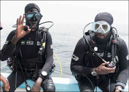 Senegal Divers Two divers from the program prepare to enter the water.