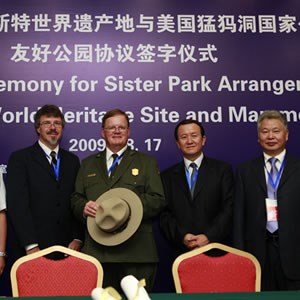 lt= The Mammoth Cave National Park superintendent attends a formal dinner in China to sign a sister park arrangment document.