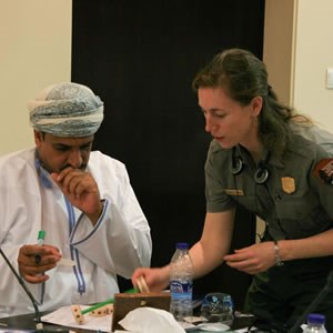 An NPS ranger instructs an Omani participant during the interpretive training. An NPS ranger instructs an Omani participant during the interpretive training.