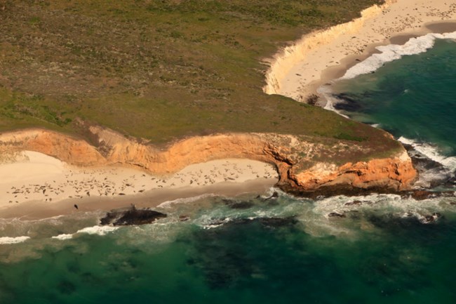 aerial view of edge of san miguel island protruding into ocean