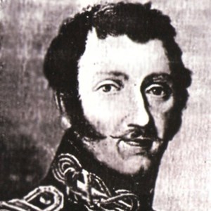 lt= Historic black and white photo of elderly man with black hair in black jacket.