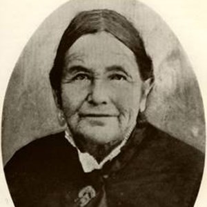 Historic photo of elderly woman in black dress.