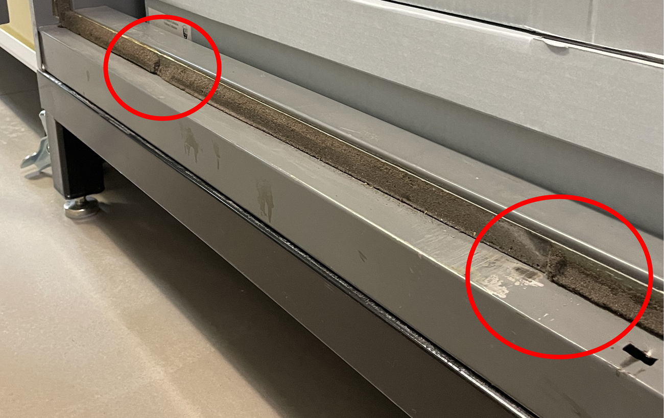 Foam gasketing with deteriorating portions highlighted with red circles.