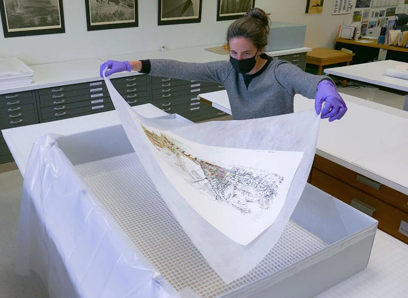Figure 6. Lifting document using non-woven spun polyester fabric. Note the gentle “drape” in the paper.