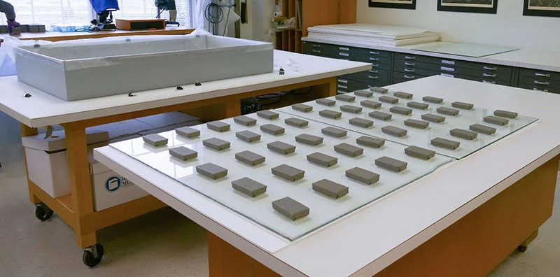 Flattening stack with weights.