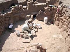 lt= Archeologist working in the kiva at Grand Canyon National Park