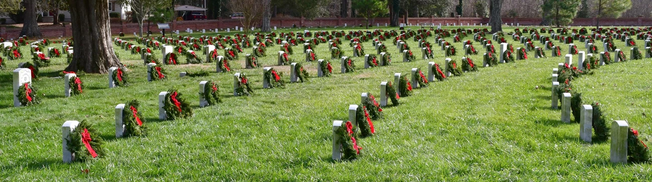 PETE Wreaths Across America Wreaths on each grave accentuates the circular pattern of headstones at Poplar Grove National Cemetery.