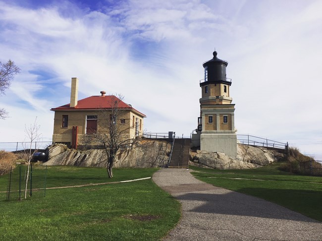 front view of Split Rock Light Station with a cloudy sky