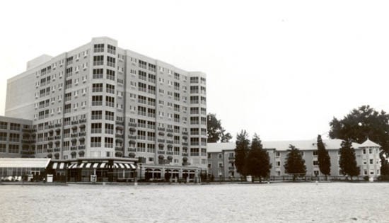 Breakers Towers addition, left, looms over one of the original wings of the Hotel Breakers to the right