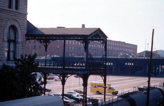 view of entrance to trainshed, now a parking lot, facing east