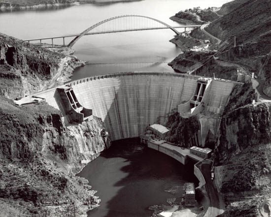 Aerial view of the reconstructed Roosevelt Dam with Roosevelt Lake Bridge in the background Aerial view of the reconstructed Roosevelt Dam with Roosevelt Lake Bridge in the background