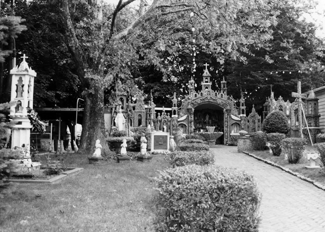 00001276 Our Lady of Mt Carmel Grotto (NY) view Image of religious sculptures.