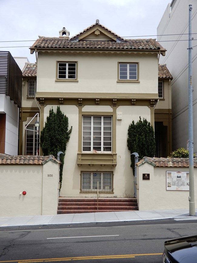 The building consists of a two-story-over-raised-basement frame building constructed in 1932.