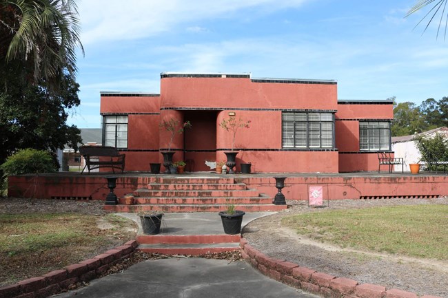 A red building with a brick wall