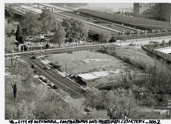 Aerial view of open land surrounded by city streets