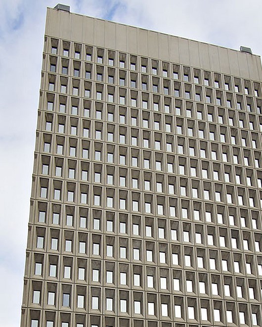 MO_Jackson County_Ten Main Center_view copy Image of portion of tall white building with many windows.