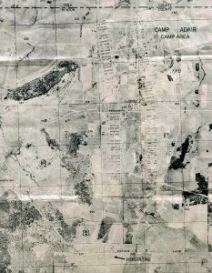 Aerial map with light and dark patches, grid work. Text at top reads Camp Adair camp area, text bottom reads Hospital.