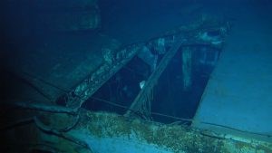 USS Indianapolis wreck site Color image in shades of blue and green of rectangular opening in metal platform.
