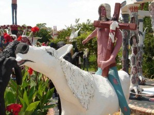Hill bearing a cross by horseback.