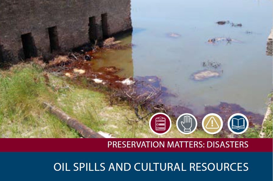 A masontry building with water that has crude oil in it from an oil spill surrounding it