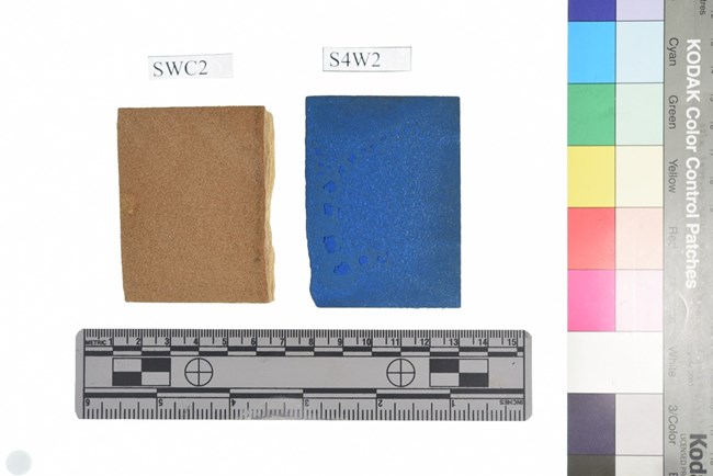 Sandstone Sample from NCPTT fire retardant study Two rectangular sandstone samples, the one on the left is dyed blue. The are above a ruler and to the left of a color control patch.