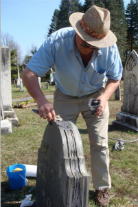 Irving Slavid applies a fill to a delaminated slate. Irving Slavid applies a fill to a delaminated slate.
