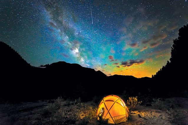 Brilliant stars rise above a camping site along Baker River, North Cascades National Park. Story by Oliver Lazenby / Photo by Andy Porter — from Mount Baker Experience Magazine