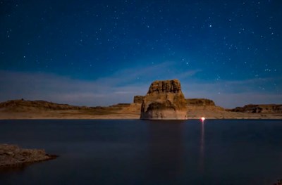 Night view of starry sky over rock forms at Lake Powell, Glen Canyon National Recreation Area.