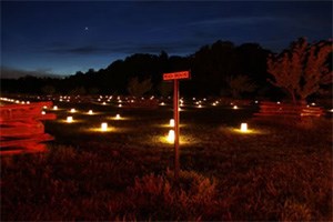 lt= A naturally dark setting enhances the impact of luminaries honoring the fallen soldiers at Shiloh National Military Park.