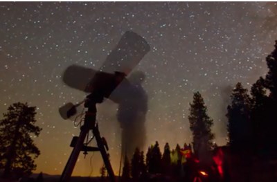 Yosemite stargazing program Night view of starry sky and people using a telescope