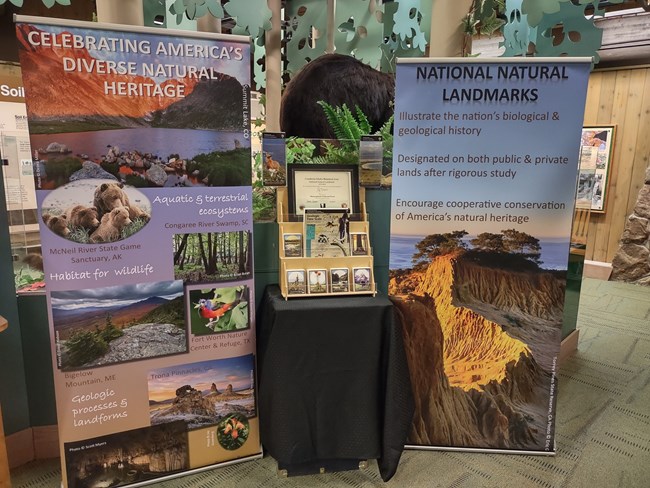 an outreach display with educational banners and outreach materials
