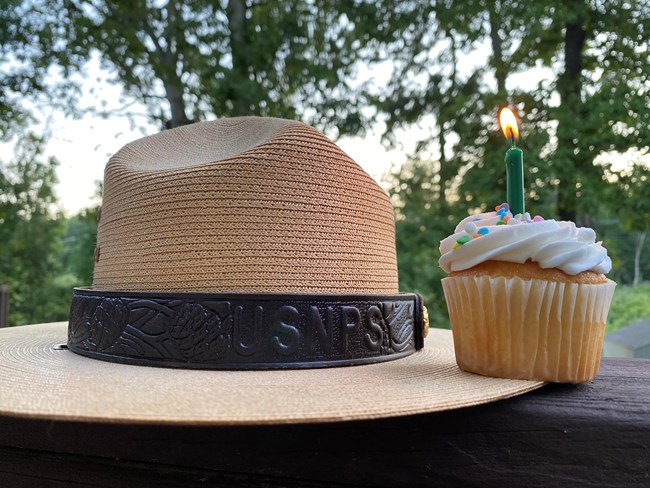 Birthday cupcake next to a ranger hat