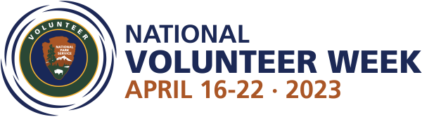 lt= A logo with the words "National Volunteer Week / April 16-22, 2023. To the left of the words is a graphic with a circular logo with 8 curved blue line segements representing ripples extending outward. The circular logo contains a blue circle nested in a g