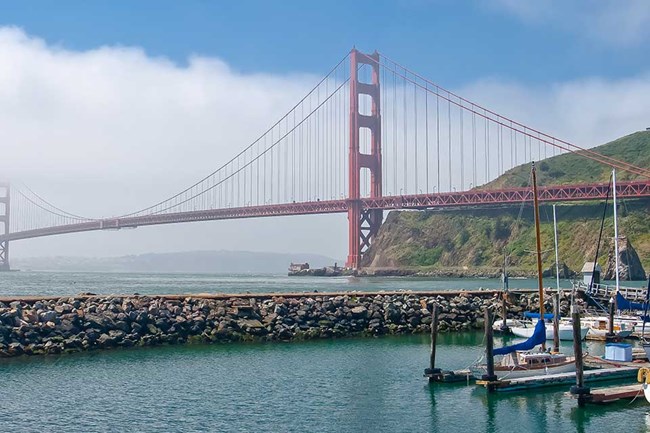 golden gate bridge with boats in the foreground