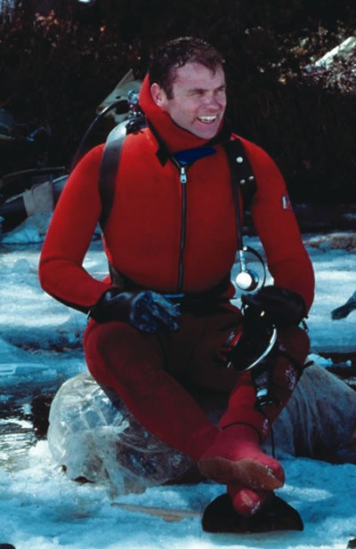 Butch Farabee, seated and wearing scuba gear.