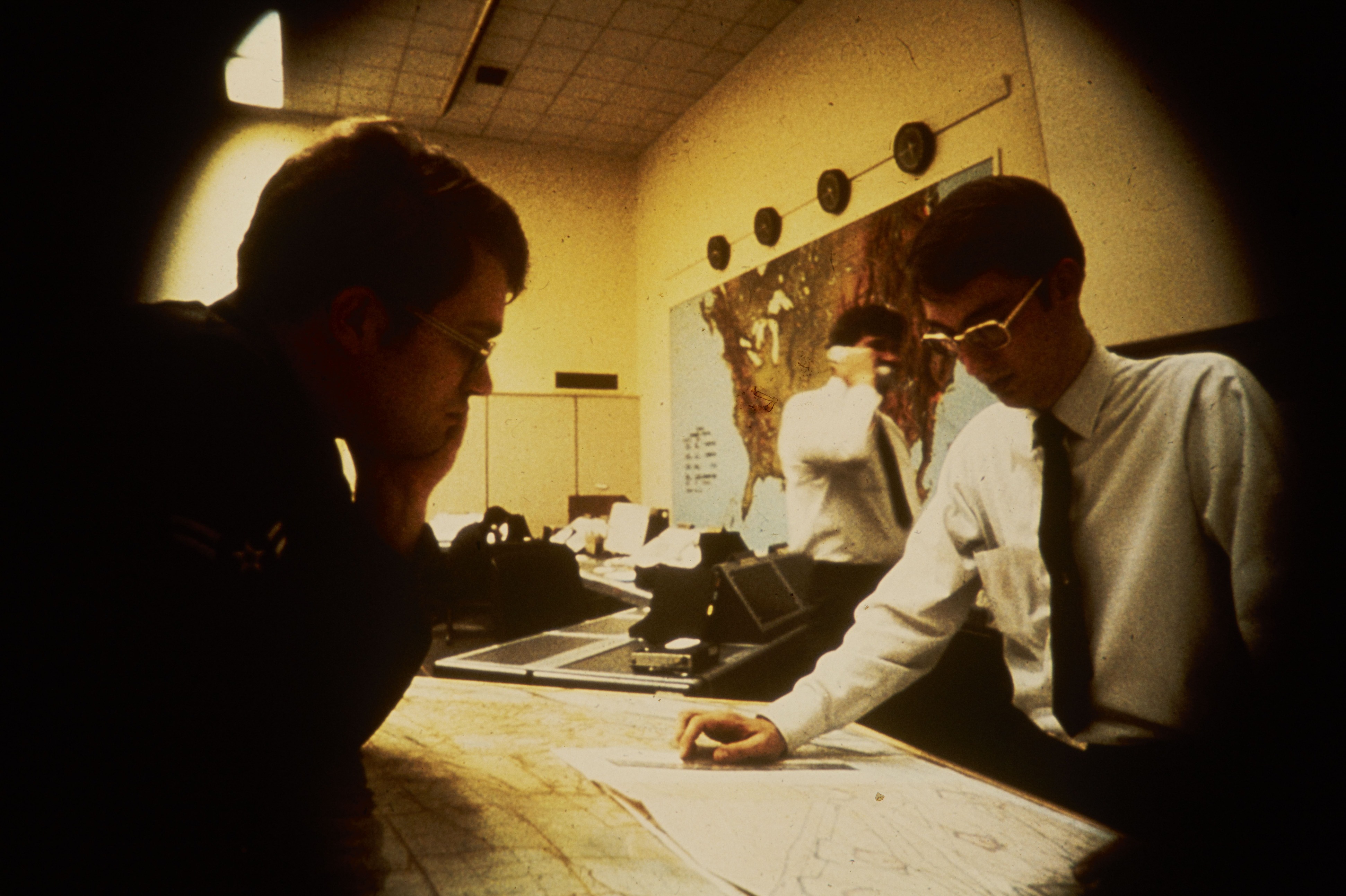NPS employees looking over maps at Harpers Ferry Center