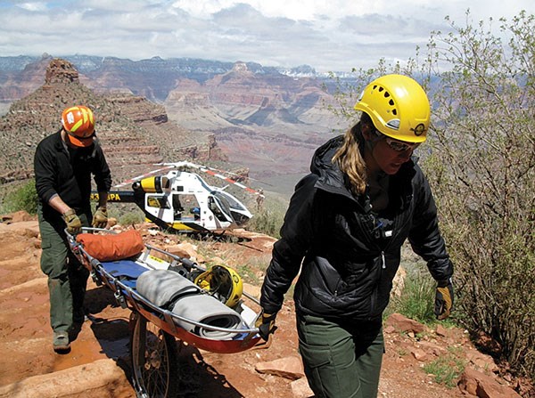 Helicopter medevac rangers wheel a litter up the Bright Angel trail for a major medical evacuation.