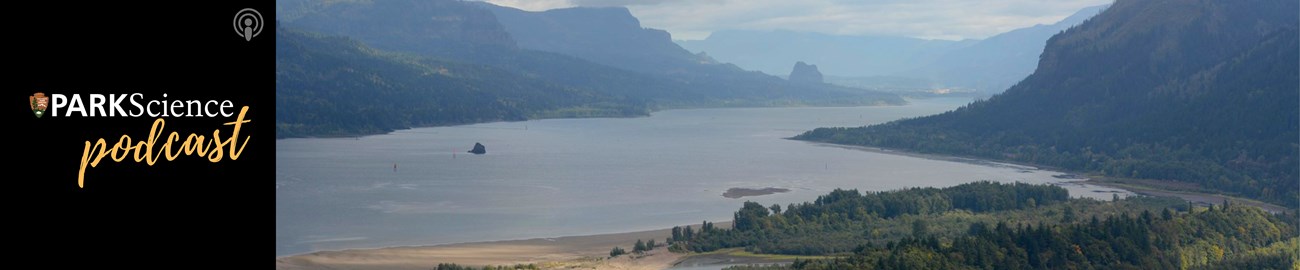 Ice Age Floods National Geologic Trail Misty scene of mountains over water with green vegetation in foreground