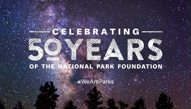 NPF 50th -- Starry Night starry sky backdrop behind words saying celebrating 50 years of the National Park Foundation hashtag We Are Parks