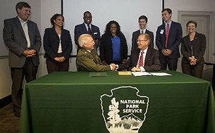 Director Jon Jarvis signs the NPS and Boys and Girls Club of America Memorandum of Understanding.
