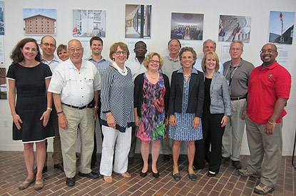 Members of the committee pose for a group photograph during their last committee meeting.